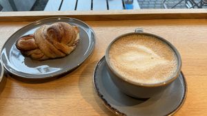 Cinnamon snail & coffee  at Godt Brød Munch Brygge in Oslo