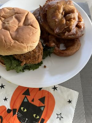 Chicken cluck sandwich with ranch dressing and onion rings   at Bitchin Donuts in Albany