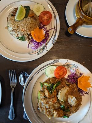 Spicy basil fried rice with mock duck (top) and pad see aew with tofu and vegetables (bottom) at Green Elephants Thai Vegan in Watkins Glen