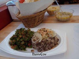 Beans rice with small brown peas, caramelized onions and roasted almonds, side dish salad of choice (shown with tabulleh) at Kebab in Maracaibo