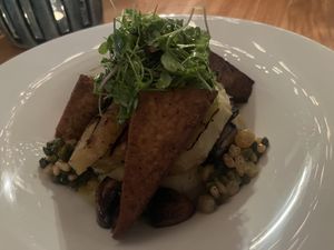 Grilled celery root steak with mash, horseradish pan fried mushrooms served with marinated grilled tofu  at Restaurant Fort Nassau in Willemstad