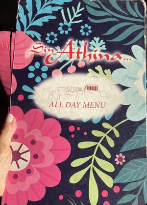 Colorful menu cover  at Sin Athina  in Athens
