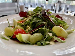 Close-up of the green salad. It really wasn’t Green because it has beautiful fruit in it and tomatoes and other colorful things.  at Sin Athina  in Athens