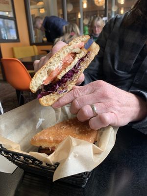 House baked Ciabatta, Crispy Maple Soy Tofu, Shredded Cabbage, Scallions Tomato Vegan Mayo & Japanese BBQ Sauce.  at Small Point Café in Providence