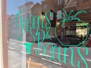 Logo on window at Greens&Beans  in Bruges