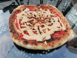 Sausages vegan pizza at PLANTS Kitchen & Bar in Almaty