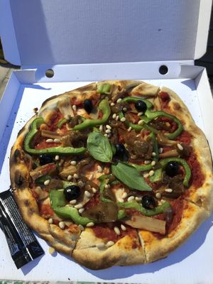 Vegan pizza with pine nuts candied onions and bambus  at Press Start in Montpellier