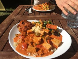 Red Thai curry, Moroccan chick pea salad, jacket potato, roast veg salad, and hummus. at Manna Haven in Byron Bay