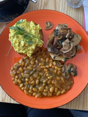 Breakfast muffin with extra masala beans  at Door to the Cosmos in Lowestoft
