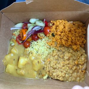 rice noodles, yukka curry, lentil dahl, salad, coconut sambol  at Blue Lotus Temple in Woodstock