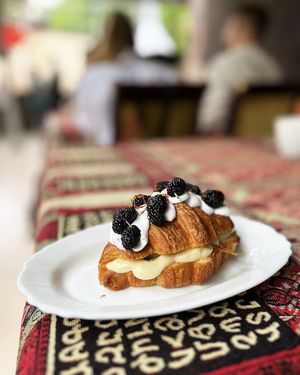 Fantastic vegan croissant with sweet lemon cream, olives (yes!), whipped vegan cream and mulberries at 2022_bak in Yerevan