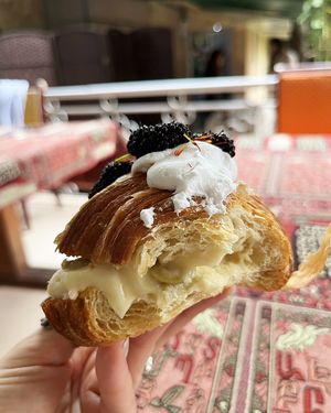 Inside—vegan croissant with sweet lemon cream, olives (yes!), whipped vegan cream and mulberries at 2022_bak in Yerevan