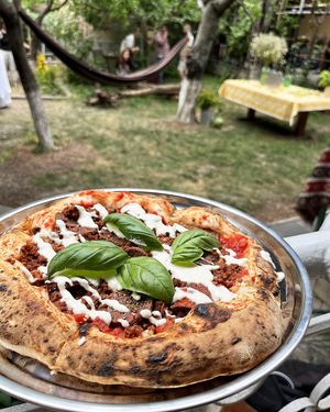 Vegan pizza Bolognese with Kolibri seitan and basturma, walnuts and arugula  at 2022_bak in Yerevan