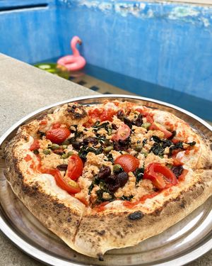 Vegan Greenwise "tuna" pizza with wakame, kalamata olives, Armenian capers, cherry tomatoes at 2022_bak in Yerevan
