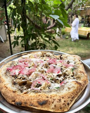 Vegan pizza with Kolibri smoked tofu, spinach, mushroom sauce, mushrooms, marinated onion at 2022_bak in Yerevan