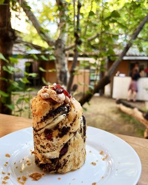 Delicious vegan cruffin with poppy seeds, berries and fruit cream at 2022_bak in Yerevan
