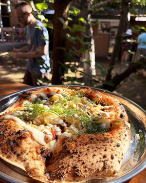 Vegan pizza with tomato sauce, Greenwise "meat", baked potato, red onion, cashew sauce and dill at 2022_bak in Yerevan