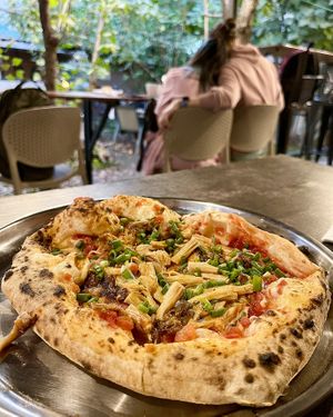 Hearty Tom Yum pizza at 2022_bak in Yerevan