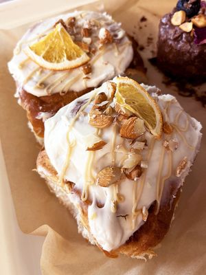 Vegan classic cinnabons with orange cream and almonds at 2022_bak in Yerevan