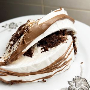 Incredible vegan Pancho cake with chocolate biscuits, pineapple and crushed walnuts inside at 2022_bak in Yerevan