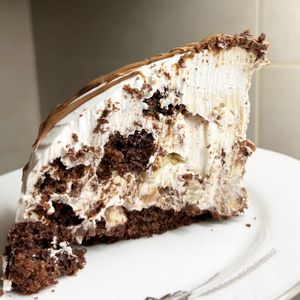 Incredible vegan Pancho cake with chocolate biscuits, pineapple and crushed walnuts inside at 2022_bak in Yerevan