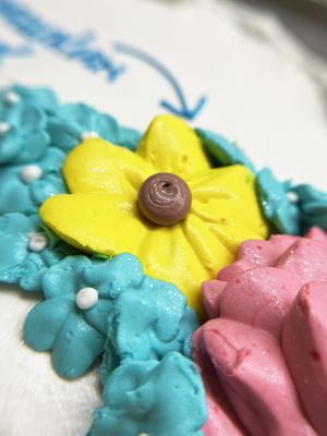 Vegan buttercream flowers on a cake, the part of my husband's special piece of cake. As you can see the flowers even shine! at 2022_bak in Yerevan