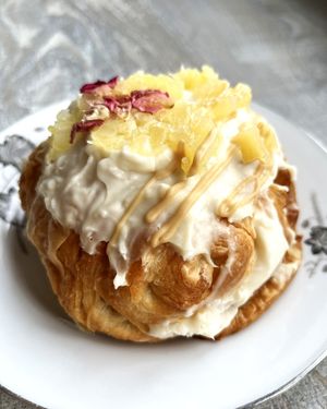 🍍🥥 Vegan twisted bun with buttercream inside, caramel, coconut and pineapples at 2022_bak in Yerevan