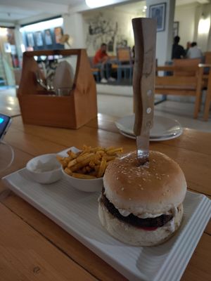 Vegan burger with fries at Beatles Cafe in Rishikesh