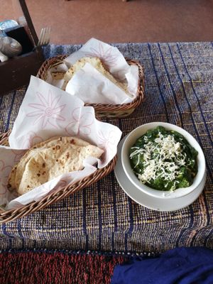 Vegan Indian Curry with spinach and sweetcorn together with Naan and Chapati (Bread has to be ordered separately)  at Beatles Cafe in Rishikesh