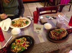 Far left: Pad Thai with veggies & tofu (no egg), near left: Outlaw Tofu (came with rice), right: Thai Time Volcano (a duck entree that came with rice) at Thai Time Cafe in Joplin