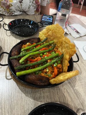 Vegan Paella with a mix of fried sweet plantains and plaintain de pana   at A La Paella in Levittown