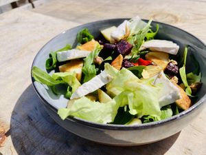 Salad with FRENCHIEZ cashew cheese (Brie style)  at Green Moustache in Gradil