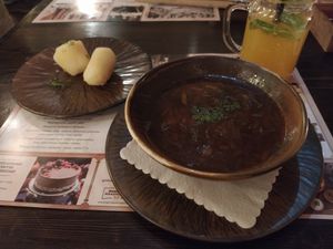 Beetroot and mushrooms soup served with boiled potatoes at Bernelių užeiga in Vilnius