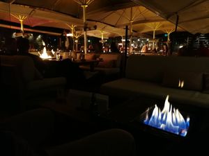 Cozy and warm outside terrace, they light the fire with your table on request at Van Heeckeren Grandcafé in Ameland