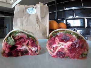 Lovely chickpea and beetroot falafels in a wholemeal wrap, topped off with sweet chilli sauce and a variety of fresh salad. Absolutely juicy and scrumptious. Filling too =) at The Vegan Coffi House in Aberdare