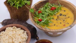 Bobo de shimeji: yuca cream, shimeji , bell pepper , tomato , dende oil and cilantro served with brown rice at Earthy Vegan Cuisine in San Jose