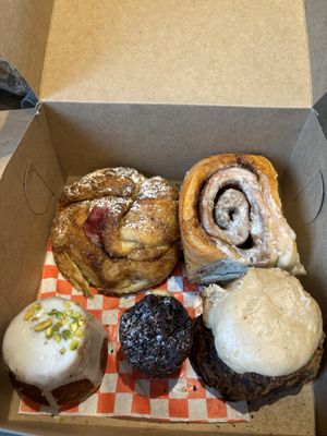 Brioche cinnamon swirl, Cinnabon bun, orange pistachio cake, chocolate cake, pumpkin scone   at Bad Attitude Bread in Toronto
