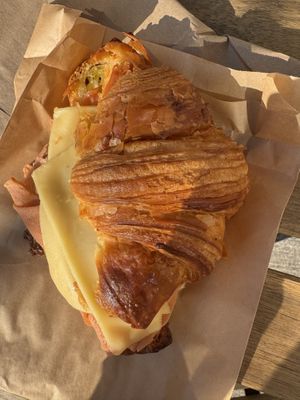Cheese croissant sandwich with vegan ham and pesto  at Bad Attitude Bread in Toronto