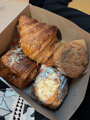 Pizza croissant, cheese croissant, almond chocolate croissant, coffee cake muffin at Bad Attitude Bread in Toronto