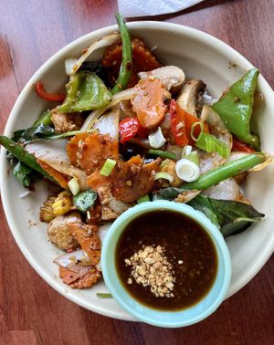 Szechuan spicy eggplant stir fry over rice noodles with side of peanut sauce   at Pho Hong in Burlington