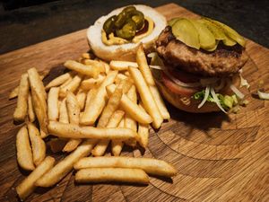 Vegan burger with pickles and jalapeños on a Sunday at Karmer Traders Hostel in Kampot