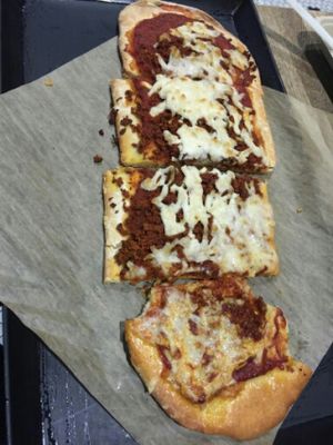 Pepperoni Pizza (already taking a bite!) at Healthy Junk in Anaheim