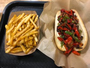 Fries and Bunny Brat with peppers and onions at Healthy Junk in Anaheim
