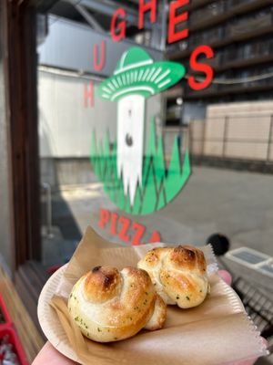 Our garlic knots. Fresh garlic, extra virgin olive oil and parsley. One portion is 2 x knots.  at Hughes Pizza ヒューズ ピザ in Osaka