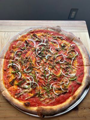 Our whole 20 inch vegan pie. Maitake mushroom, green peppers, onion and vegan cheese. at Hughes Pizza ヒューズ ピザ in Osaka