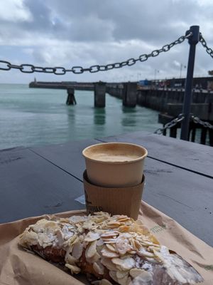 Cherry and almond croissant with oat latte and fab views at Harbour Coffee Co in Folkestone