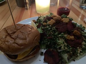 Falafel Smash Burger with a 1/2 kale saladd  at Heirloom in Vancouver