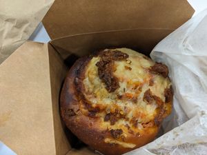 Mozzarella and pepperoni pizza roll at Woodhouse Bakery + Coffee  Shop  in Columbus