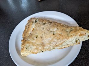 Dill pickle cheddar scone at Woodhouse Bakery + Coffee  Shop  in Columbus