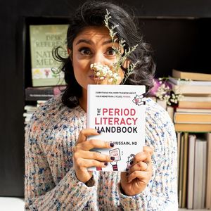 Dr. Anne with her book on periods, The Period Literacy Handbook. at Dr. Anne Hussain, ND in East Gwillimbury